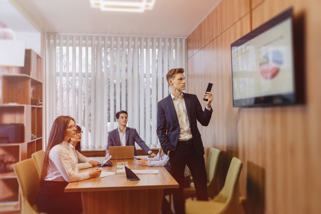 Meeting Office Workers Table Looking Presentation With Diagrams Tv 78826 2721